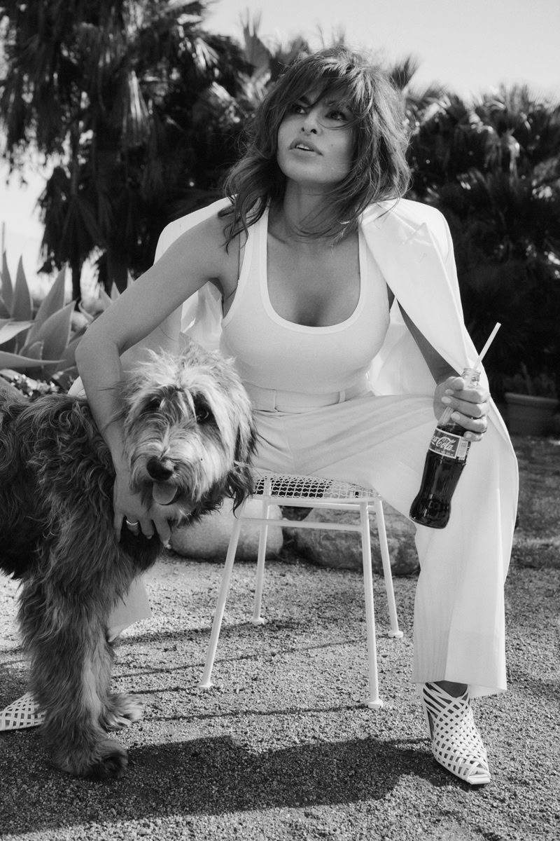 Elegant black and white portrait of a woman with a stylish outfit and a dog, showcasing candid photography by Pamela Hanson for modern portrait and lifestyle photography.