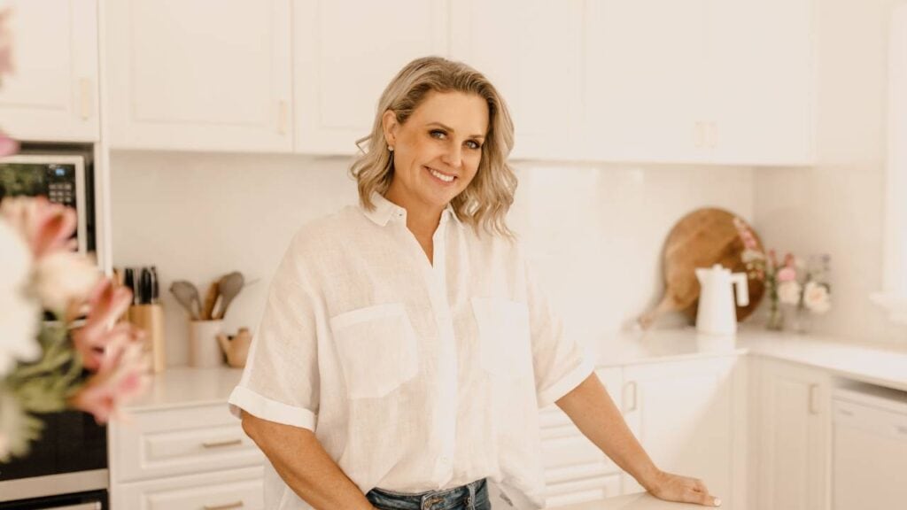 Donna Moala, founder of Parenting Collective, smiling in her kitchen