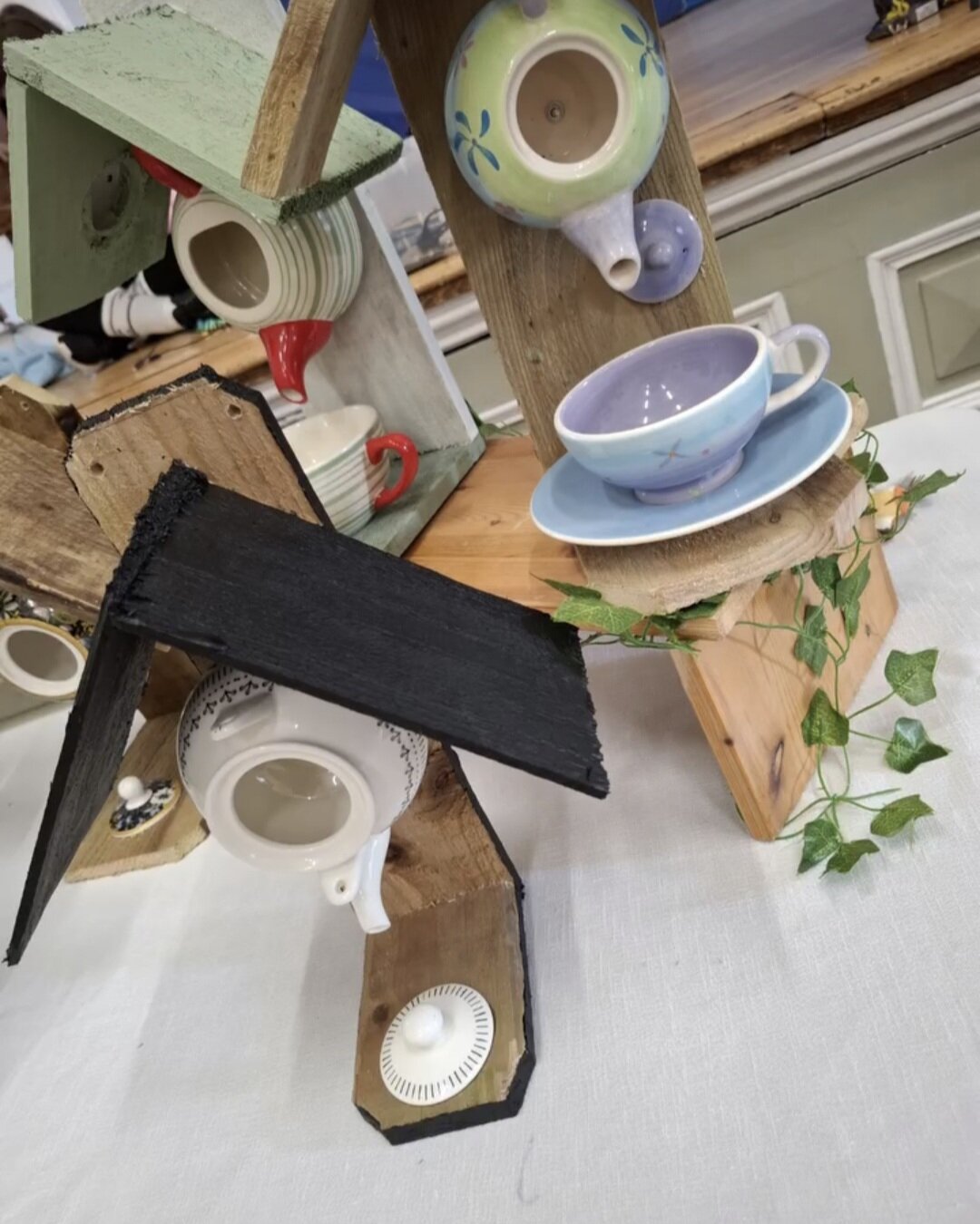 Upcycled bird feeders made from recycled materials, showcasing eco-friendly craftsmanship.