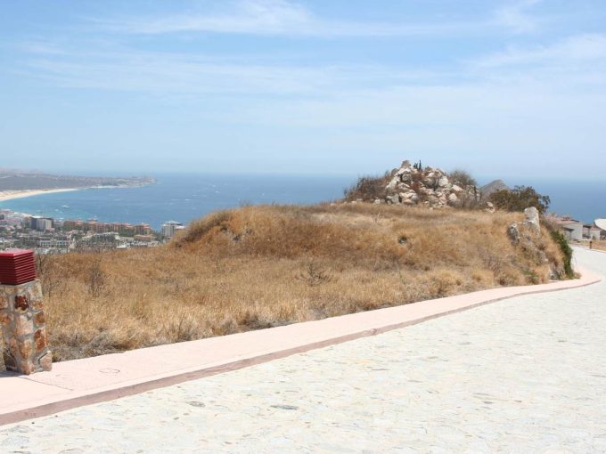 Rolling Pathway With Rocky Hill And Ocean View In Pedregal, Cabo San Lucas, Mexico.