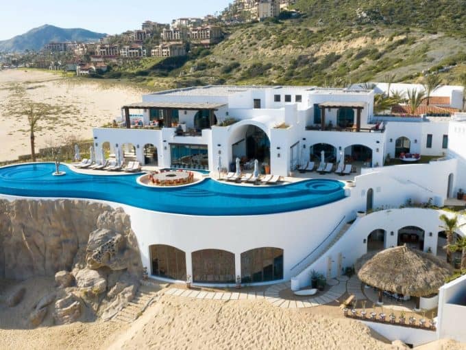 Striking Whitewashed Oceanfront Villa With Circular Infinity Pool And Beach Access In Pedregal Real Estate, Cabo San Lucas.