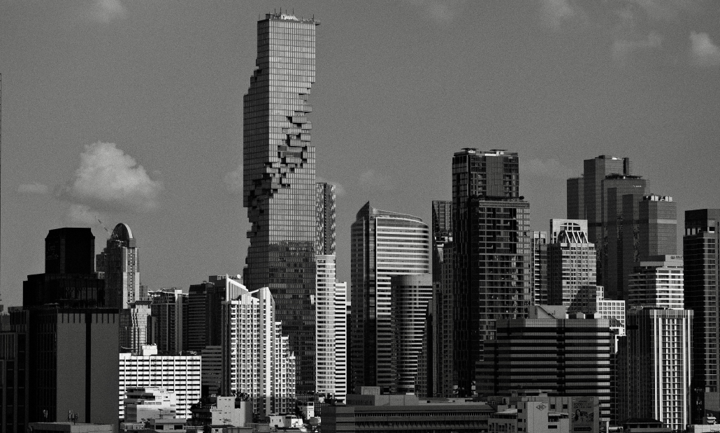 Modern city skyline with high-rise buildings in black and white.