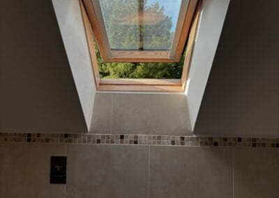 Open skylight window with tree view outside