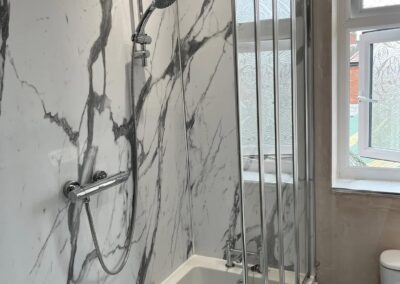 Modern bathroom with marble wall and shower