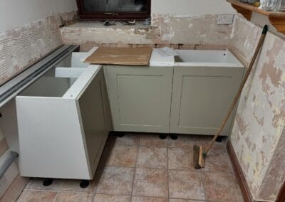 Kitchen under renovation with new cabinets installed.