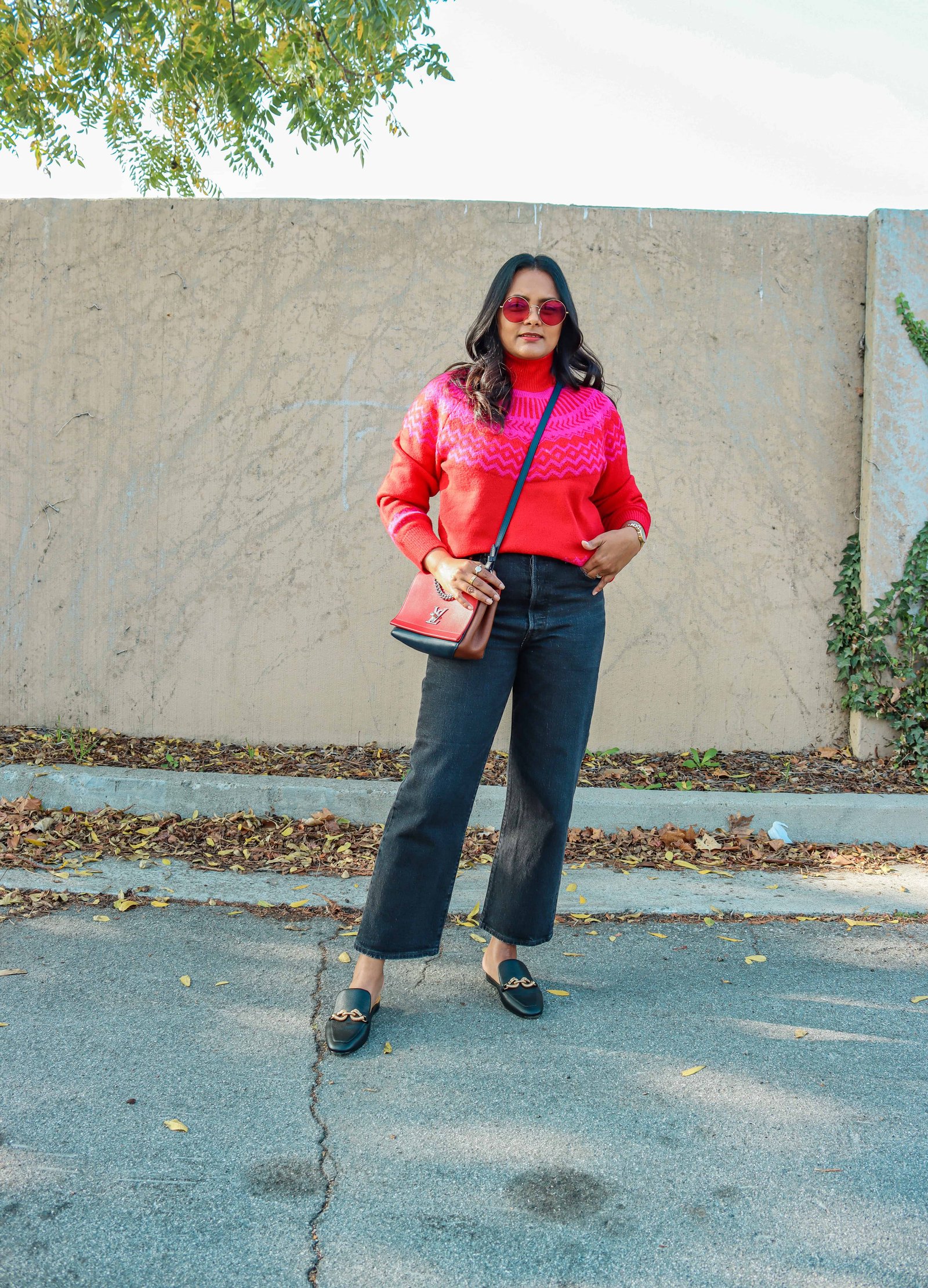 Oversized fair isle sweater with loafer mules and jeans