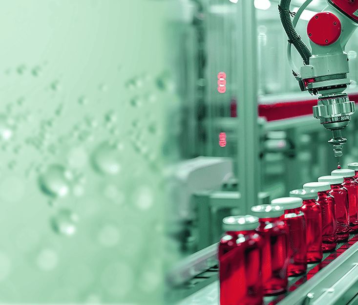 bubbles in liquid on the left and red vials in a filling line on the right