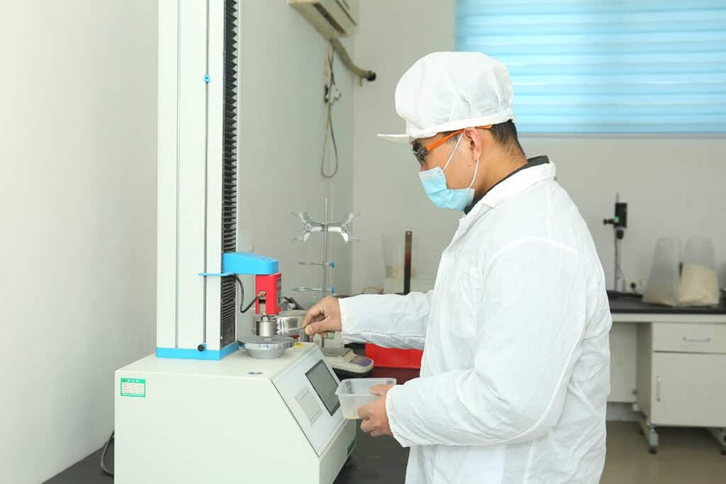 Precise industrial processing of eco-friendly cat litter at QingkePet factory.