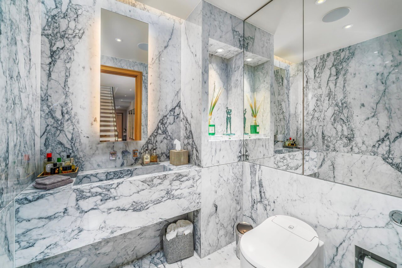 A luxurious marble bathroom with modern fixtures and elegant decor.