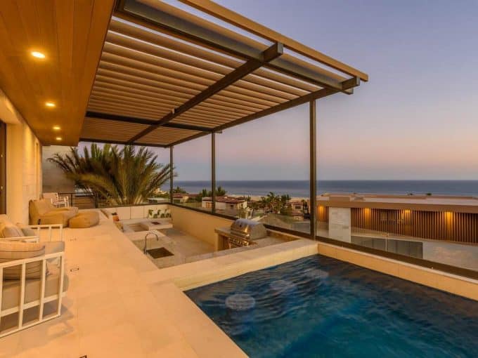 Modern Terrace With Covered Lounge, Built-In Grill, Plunge Pool, And Panoramic Pacific Ocean Views In Quivira Real Estate, Cabo San Lucas.