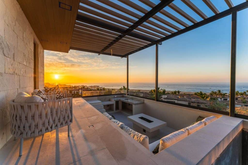 A Day In The Life At Quivira Los Cabos: From Sunrise Golf To Sunset Cocktails – Homes For Sale In Quivira Luxurious Balcony At Quivira Los Cabos With Sunset View And Panoramic Ocean Horizon.
