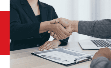 Handshake agreement between two professionals in a business meeting, representing automation solutions, collaboration, and partnership.
