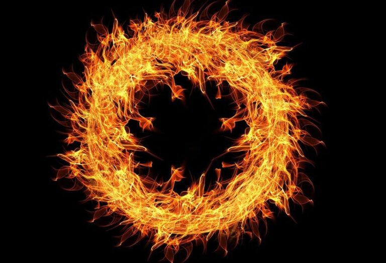 Fire ring with bright flames on a black background.