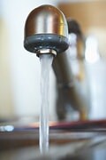 Water flowing from a modern faucet, emphasizing clean and fresh water supply.