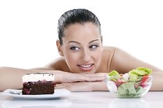 Woman with healthy dessert, berries, and greens for wellness.