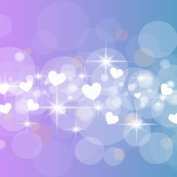Abstract bokeh background with hearts and sparkles in pastel purple and blue tones.