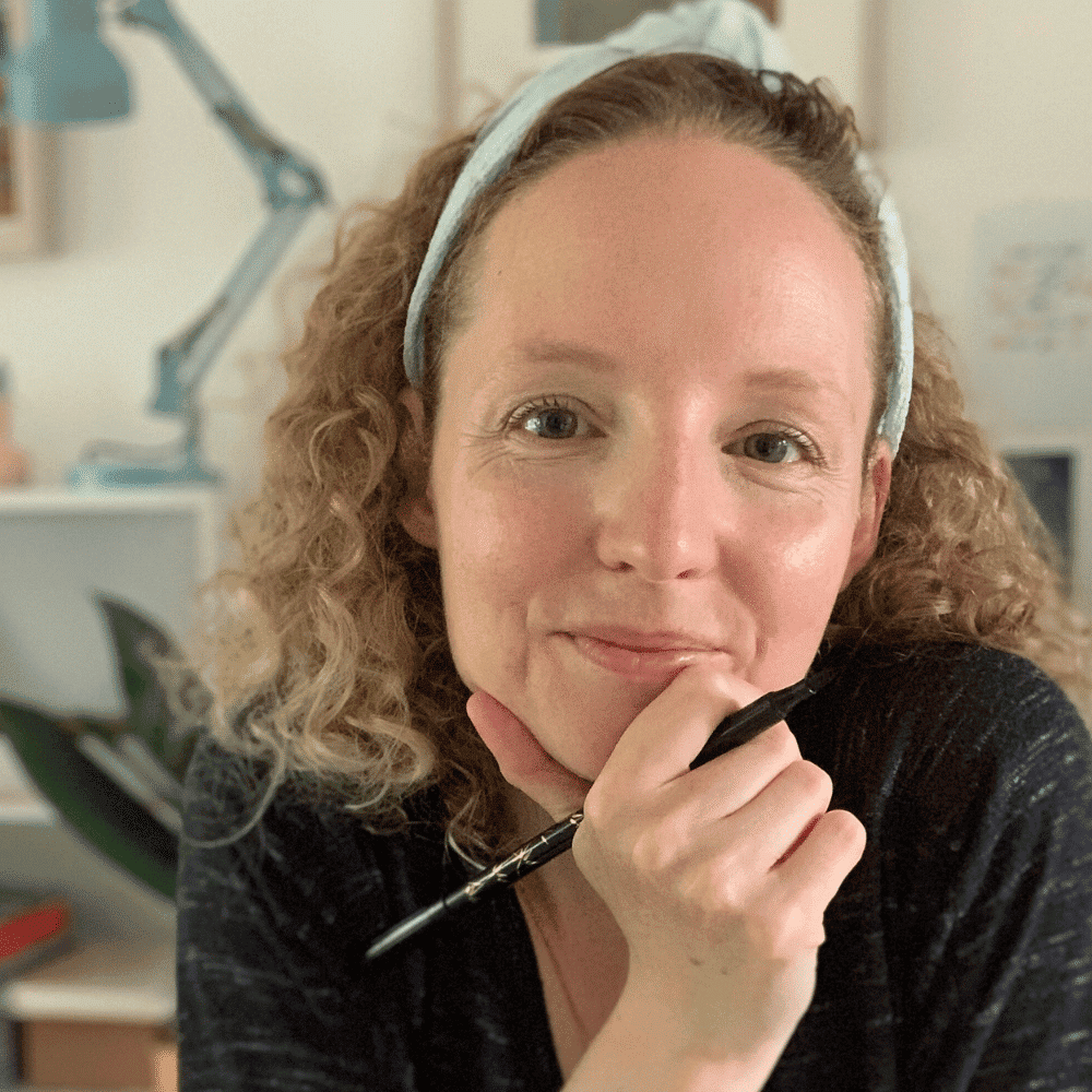 Creative woman working at her desk in a modern office environment.
