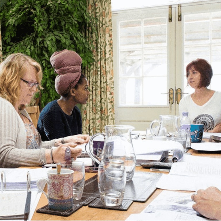 Coach training workshop at Raw Horizons discussing health and wellbeing coaching skills.