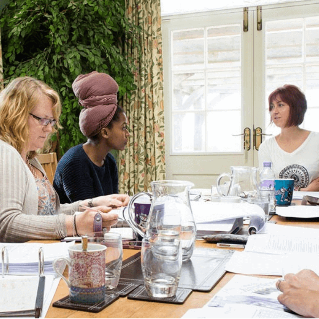 Coach training workshop at Raw Horizons discussing health and wellbeing coaching skills.