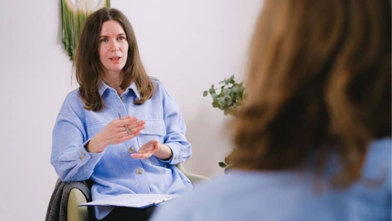 Health & Wellbeing Coach in a coaching session demonstrating the importance of life coaching skills in collaborative approach for health outcomes