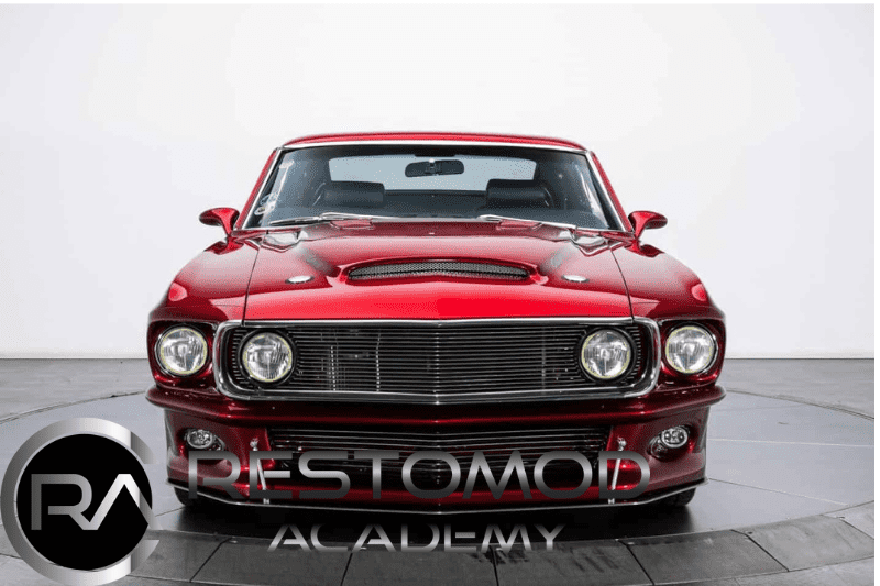 Restomod classic muscle car with custom modifications and sleek red finish.
