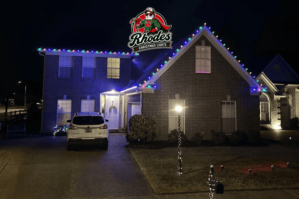 House decorated with colorful Christmas lights at night.