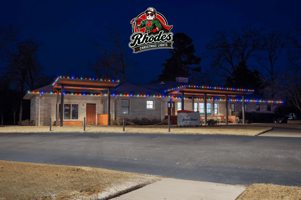 Colorful Christmas lights decorating Rhodes building at night.