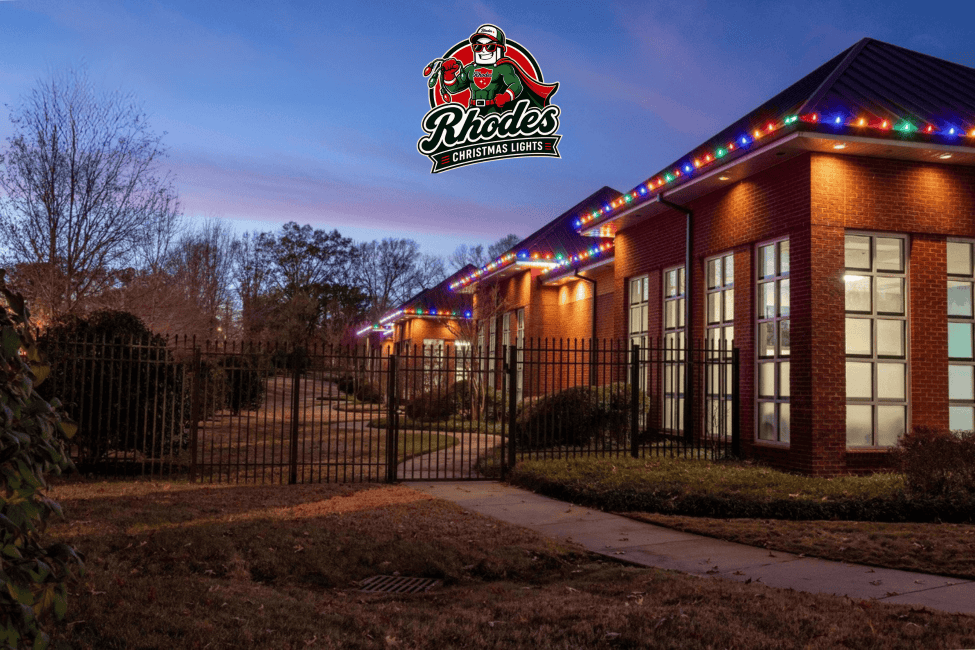 Colorful Christmas lights decorating a building at dusk.