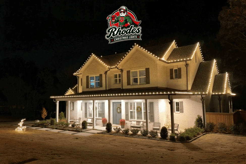 House decorated with Christmas lights and holiday decorations at night.