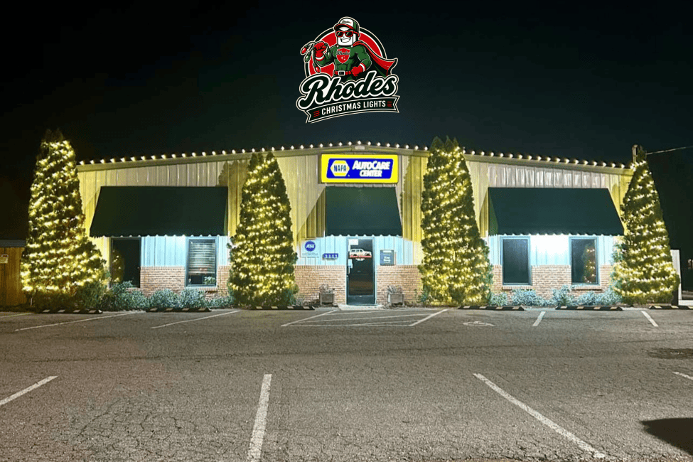 Rhodes Christmas Lights store decorated with festive holiday lighting at night.