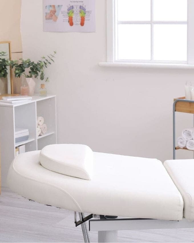 Comfortable chiropractic treatment room with a massage table and relaxing ambiance.