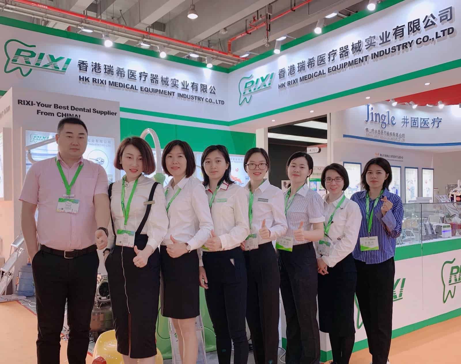 RIXI Medical team gathered at its dental equipment exhibition booth