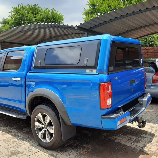 Durban stainless steel canopy on a blue pickup truck, premium vehicle protection, stylish and durable canopy solutions, custom-designed stainless steel canopies for trucks.