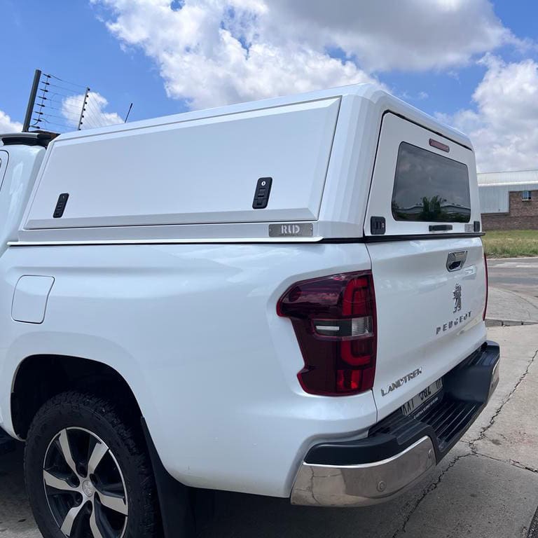 Custom stainless steel canopies for Peugeot Land Rover trucks, durable and stylish vehicle solutions, manufactured by RLD Design, enhancing truck functionality and aesthetics.