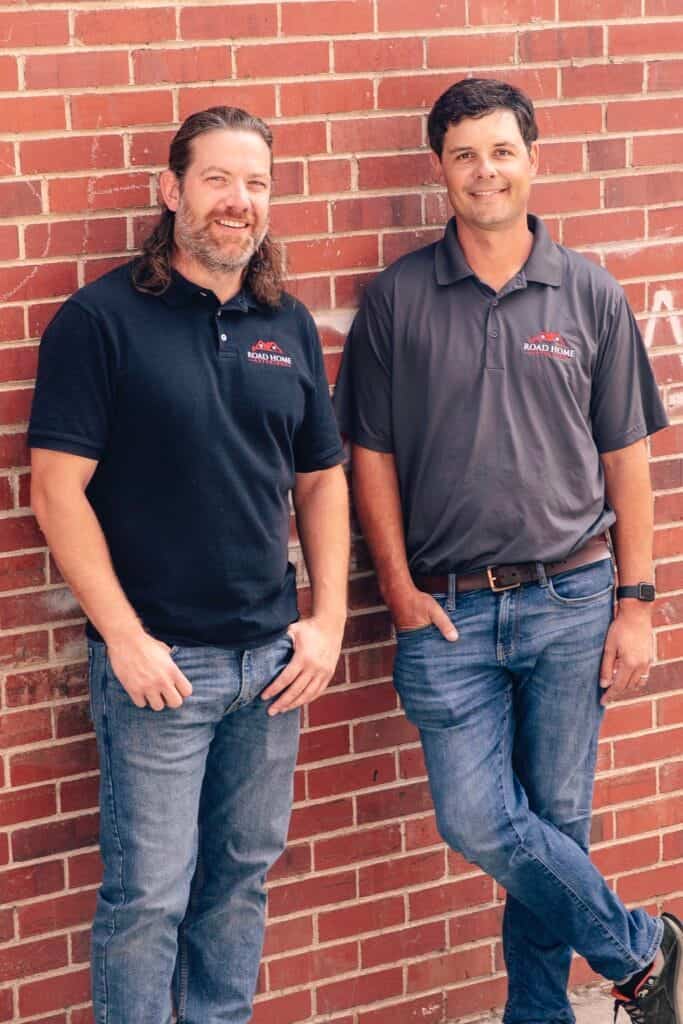 Two owners of Road Home Exteriors standing together in Colorado, representing local leadership, trust, and commitment to exterior home repairs.