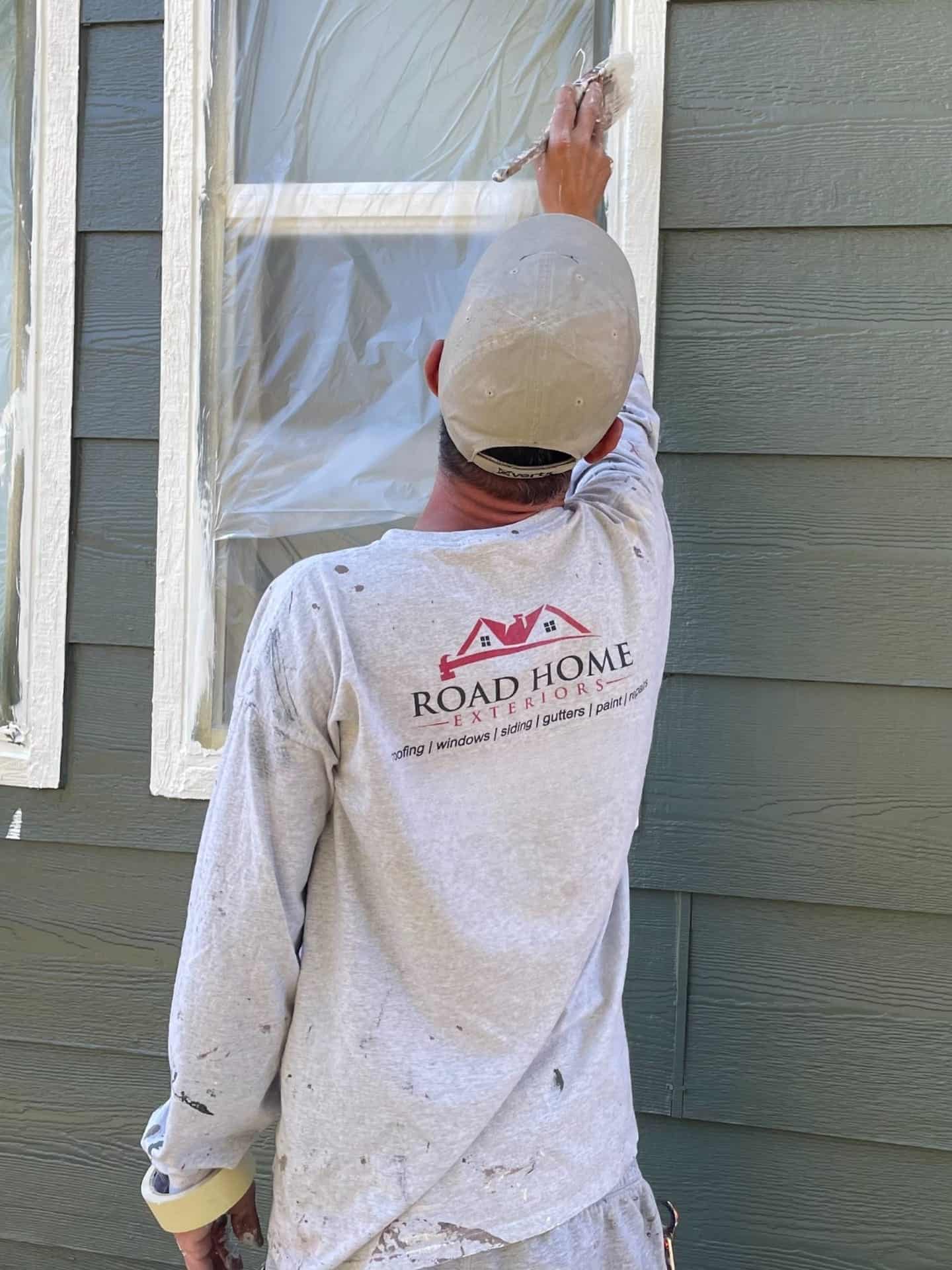 Home exterior highlighting siding and painted trim under bright daylight