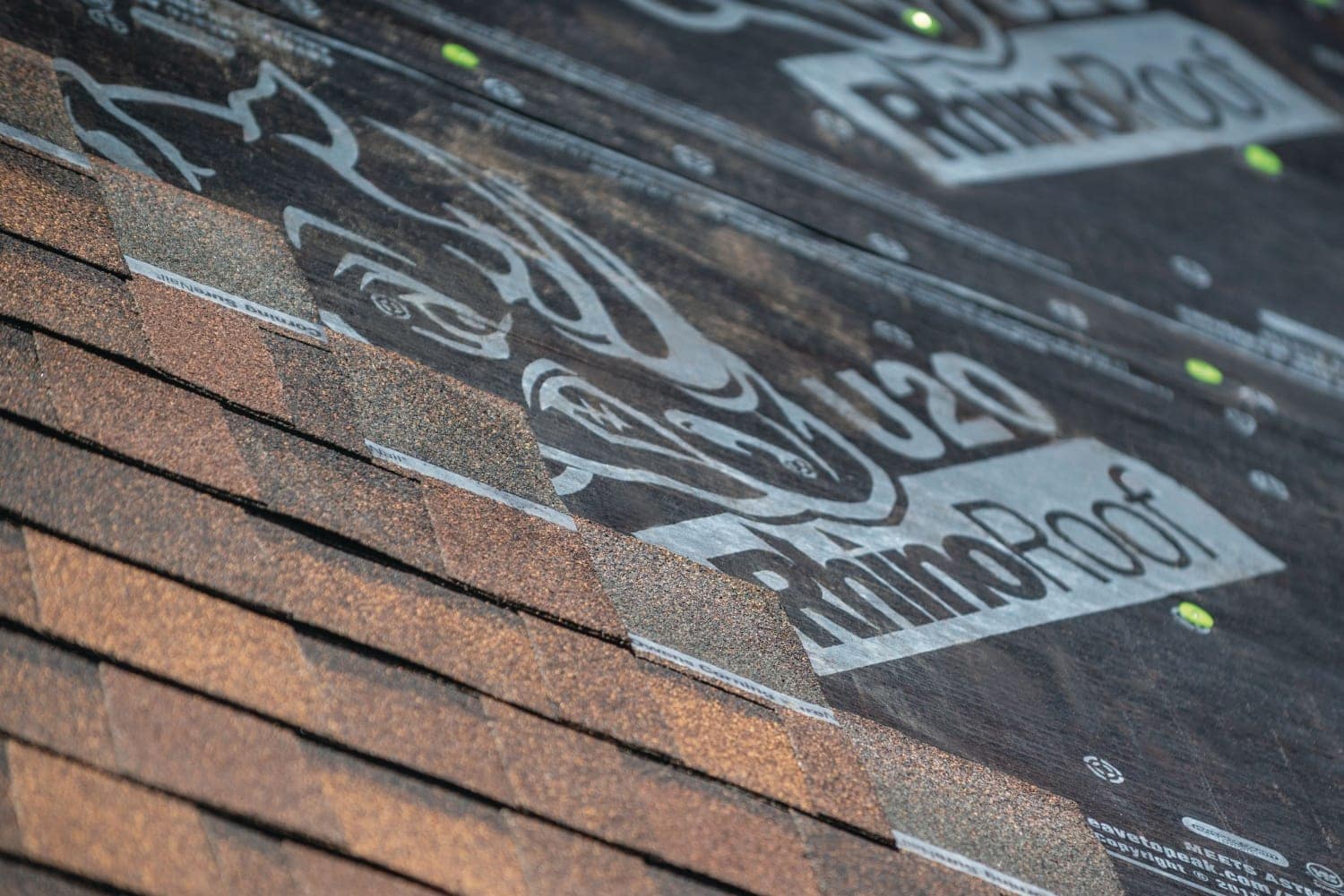 Close-up of Owens Corning shingles being installed by Road Home Exteriors in Denver Metro