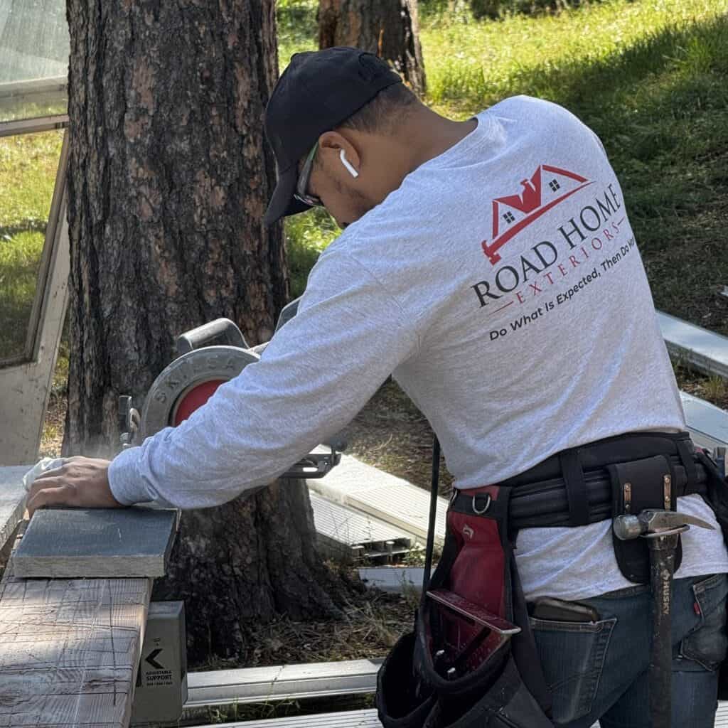 siding installation crew working on residential siding project in Colorado