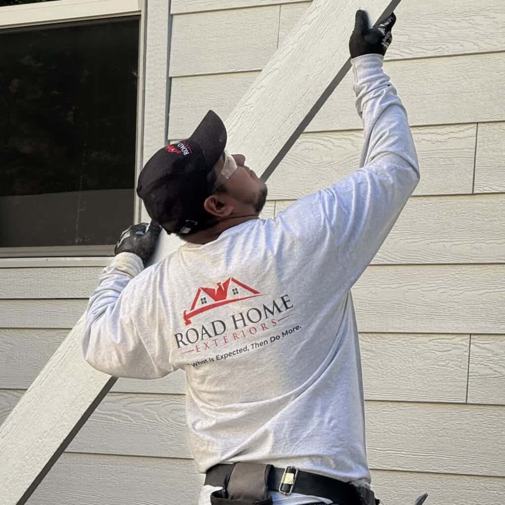 Road Home Exteriors crew installing new siding on a home in the Denver metro area