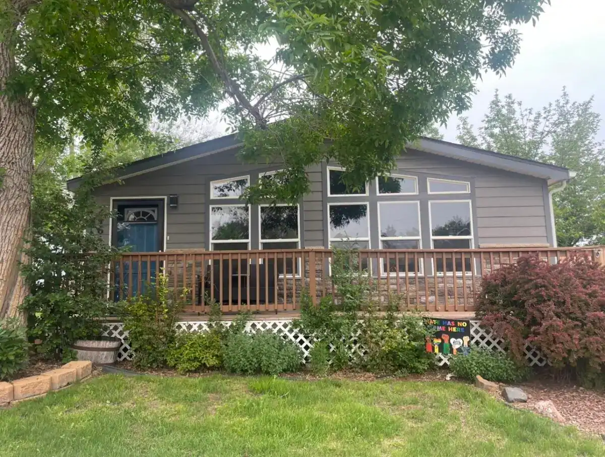Completed exterior remodeling project on a home near Sloan's Lake in Edgewater Colorado featuring new siding and replacement windows