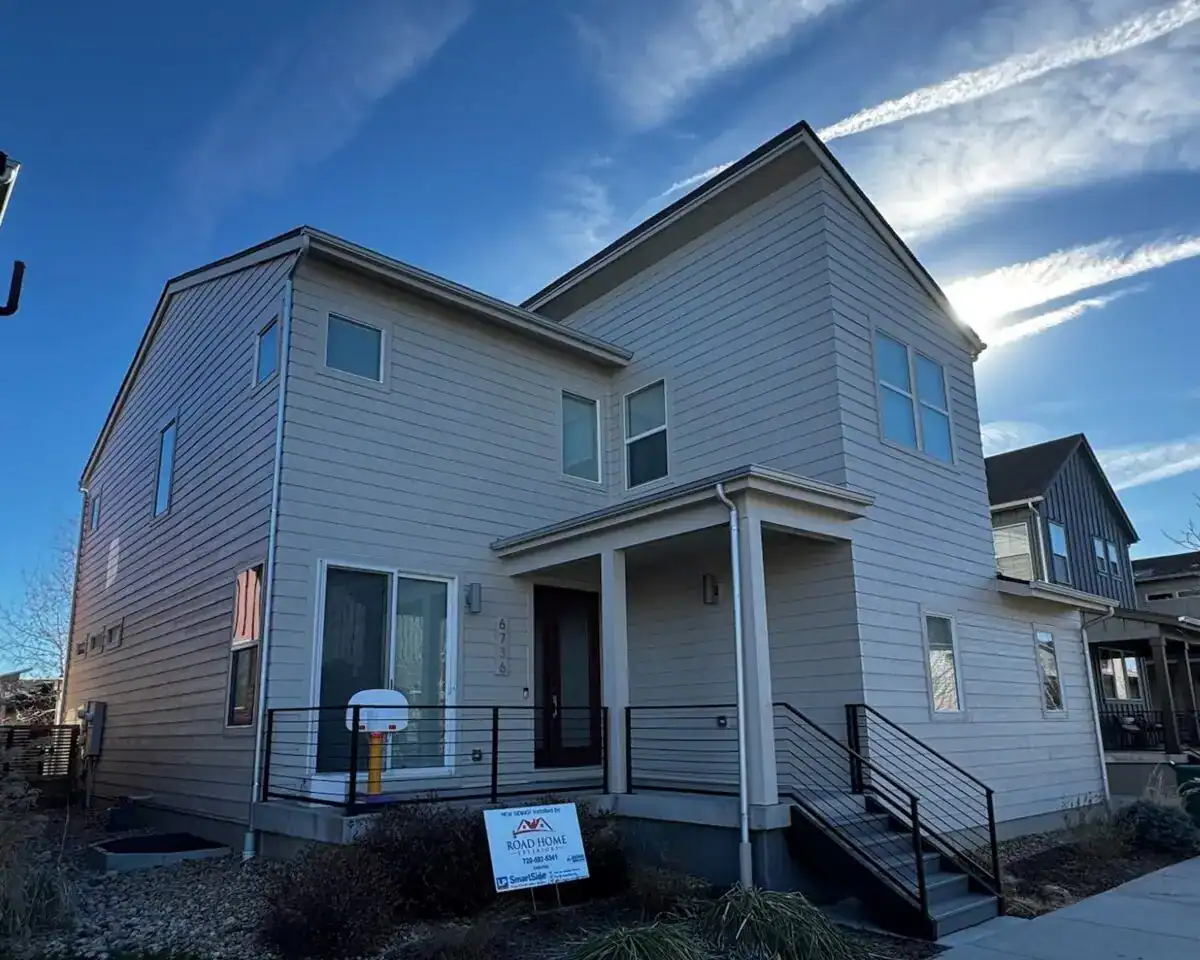 Complete exterior remodel with LP SmartSide siding, roof replacement, and new windows completed on a home in Federal Heights, Colorado by Road Home Exteriors.