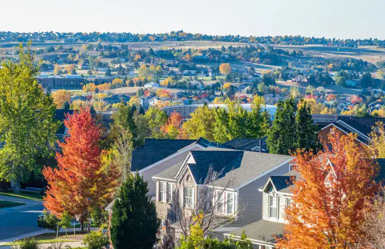 Residential neighborhoods in Lone Tree Colorado with colorful fall foliage and rolling hills in the South Metro Denver area.