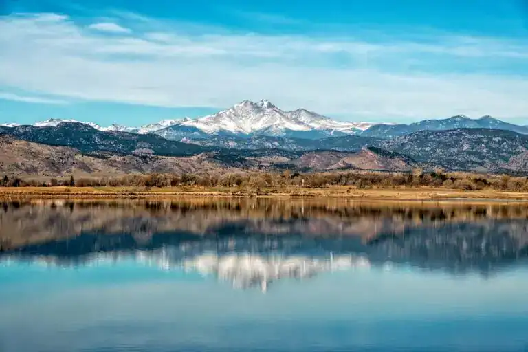 Longmont Colorado landscape with mountain views representing roofing, siding, window replacement, and exterior remodeling services in Boulder County.