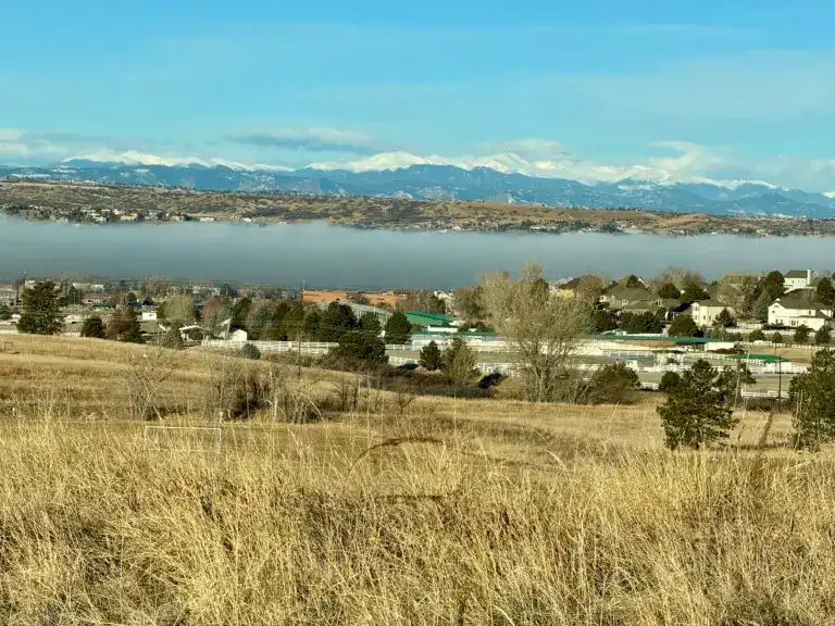 Residential neighborhoods in Parker Colorado with open space, rolling hills, and Rocky Mountain views in the South Metro area.