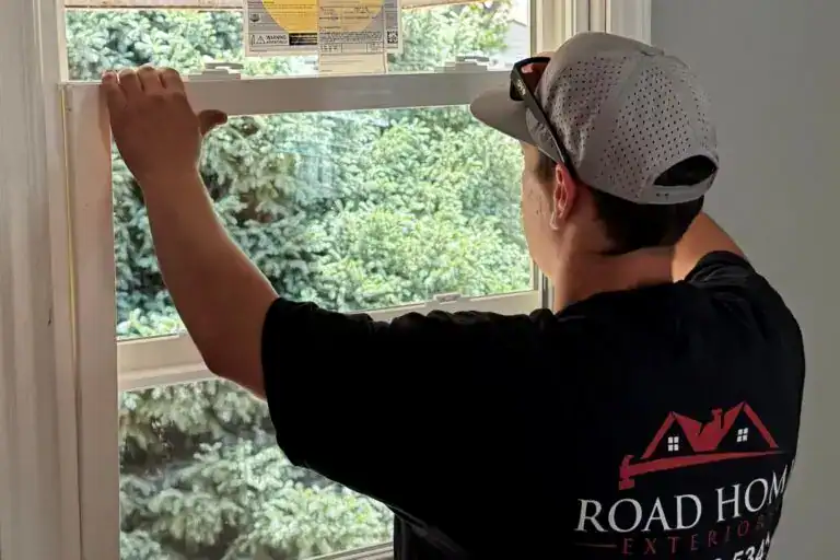 Road Home Exteriors crew replacing windows on a Colorado foothills home