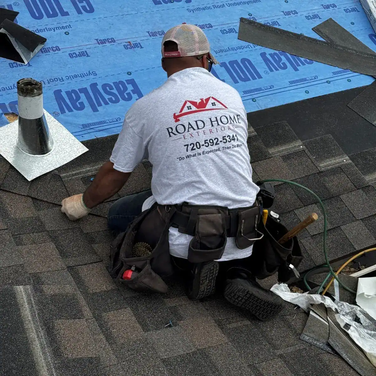 Road Home Exteriors roofing crew installing an IKO architectural shingle roof on a home in Denver, Colorado.