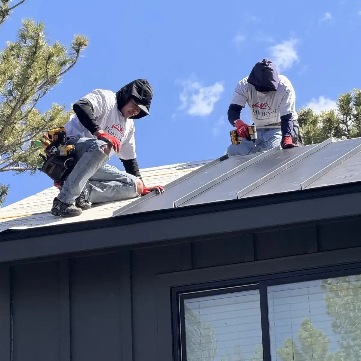 Road Home Exteriors installers installing a standing seam metal roof on a home in Nederland, Colorado for long-lasting weather and wildfire protection.