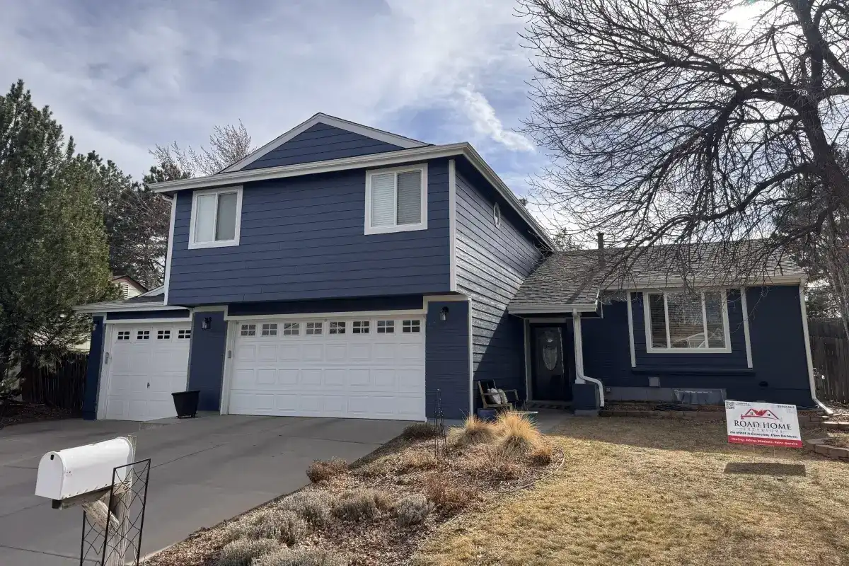 White Pella Impervia fiberglass replacement windows installed by Road Home Exteriors on a home in Centennial, Colorado for improved energy efficiency, durability, and curb appeal.