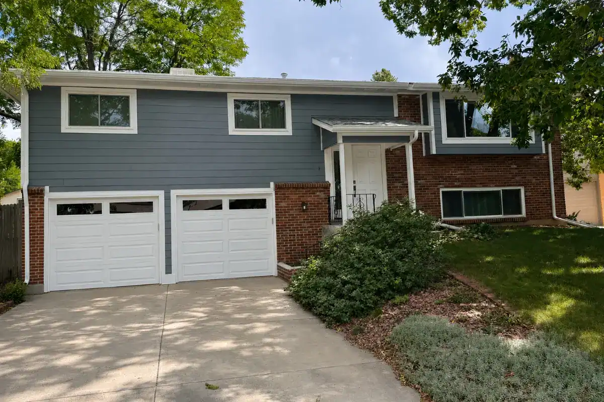 Boothbay Blue James Hardie lap siding with Arctic White trim on a home in Bear Valley, Denver