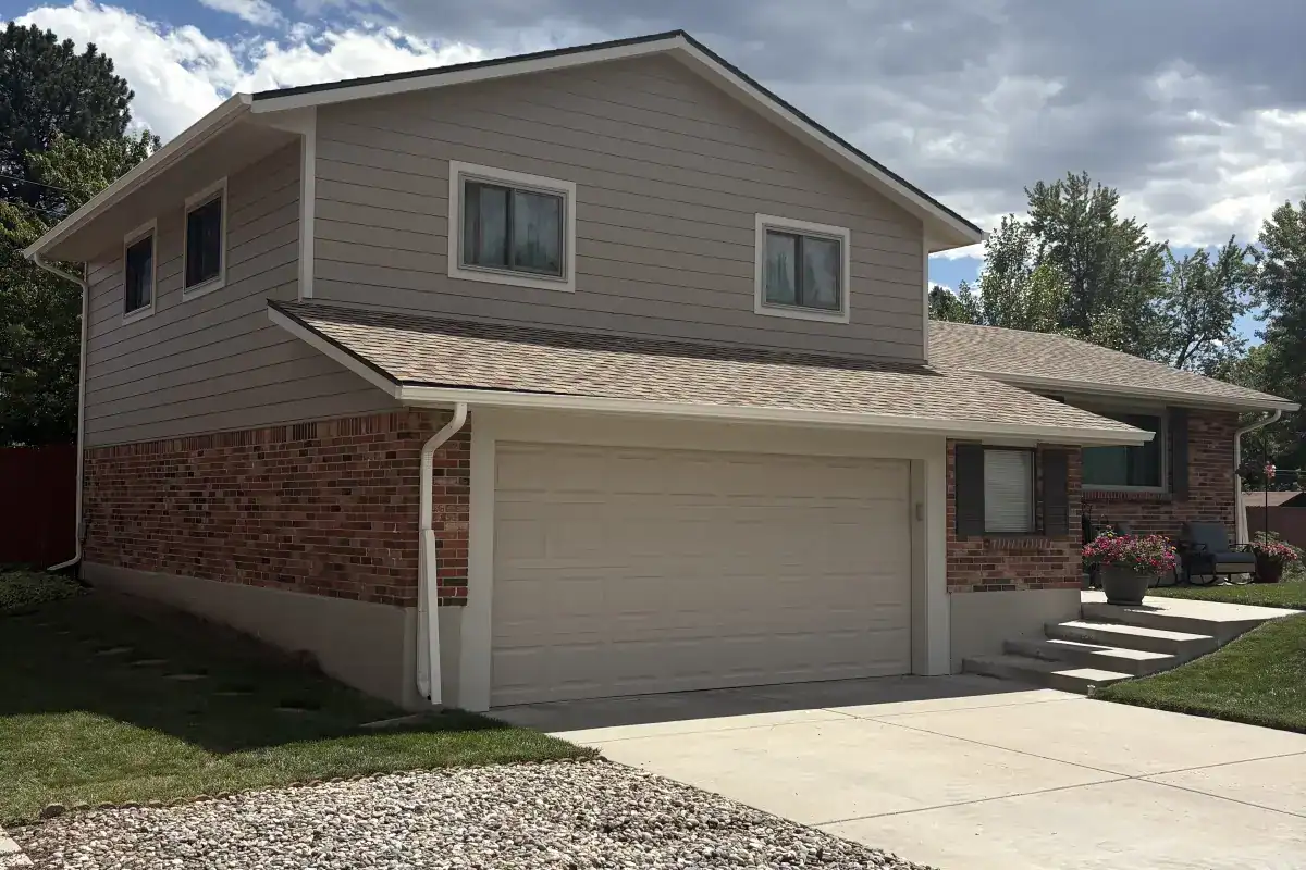 Khaki Brown James Hardie lap siding with Cobble Stone trim on a brick home in Southwest Denver
